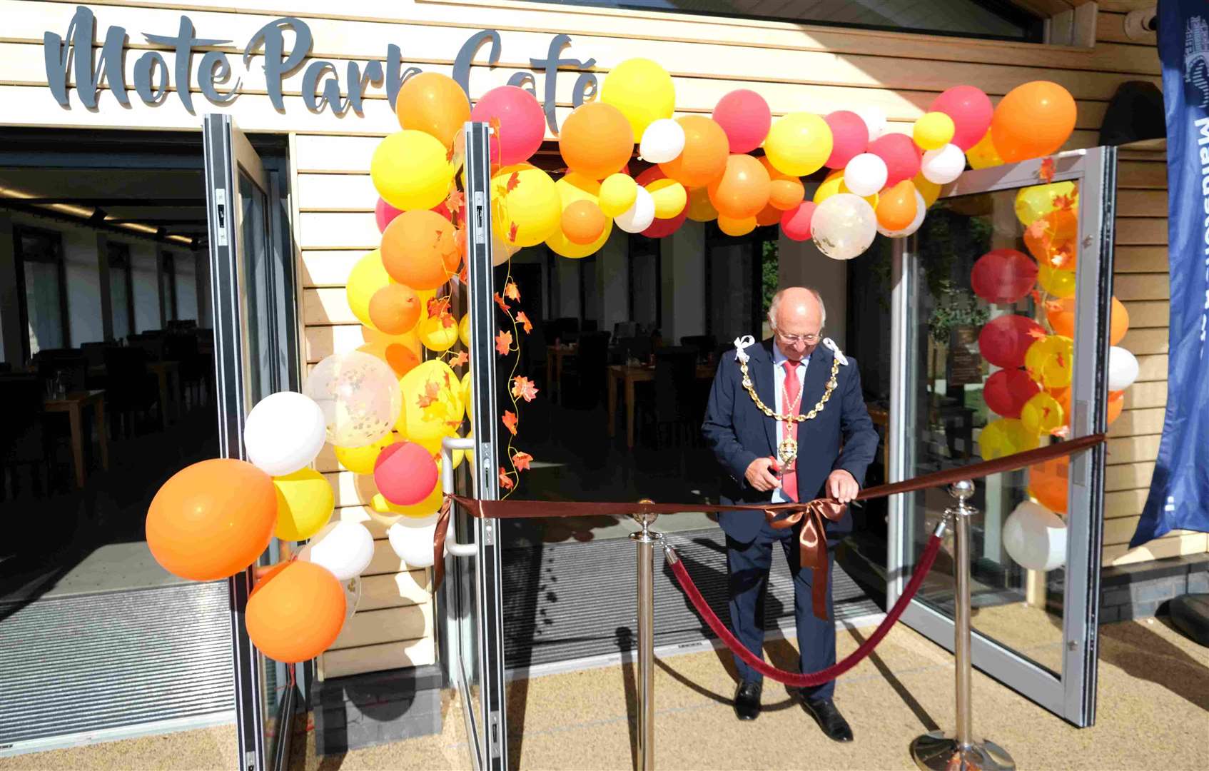 Maidstone Mayor Cllr Gordon Newton cutting the ribbon of Mote Park Cafe. Picture: Maidstone Borough Council