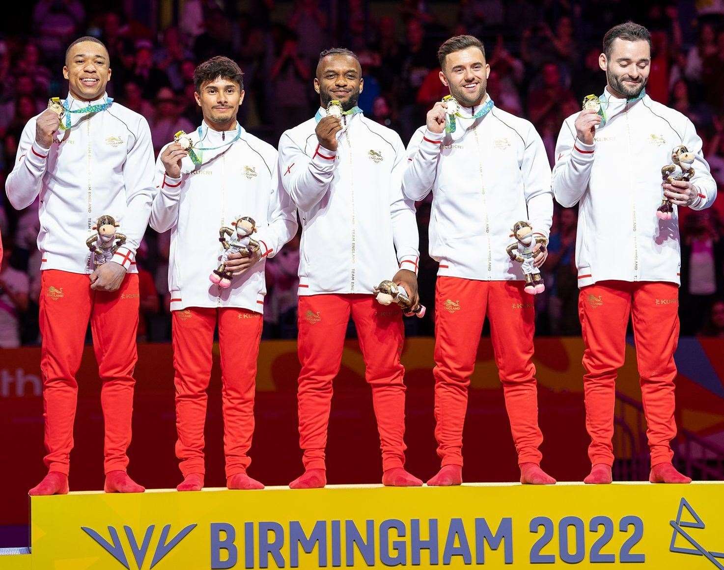 England’s James Hall, Joe Fraser, Courtney Tulloch, Giarnni Regini-Moran and Jake Jarman celebrate team gold at the Commonwealth Games. Picture: Team England
