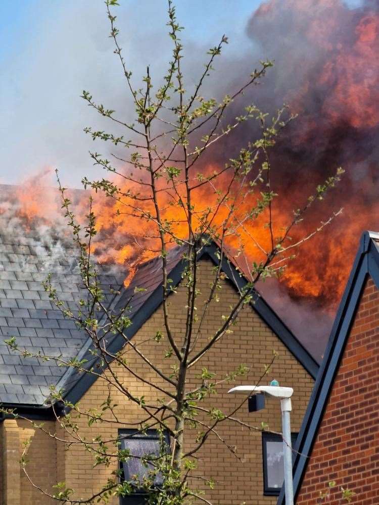 Flames rising from the roof