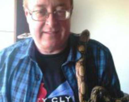 A Facebook picture shows Dale Bolinger with a pet snake around his neck