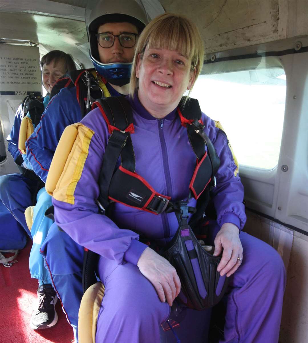 Paula just about to jump out of a plane