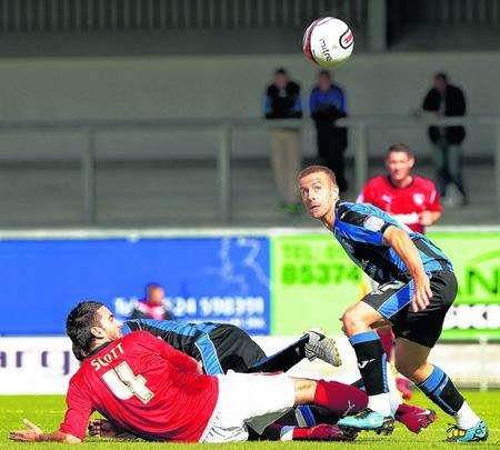 Danny SPiller battles for the ball in the 1-1 draw at Morecambe