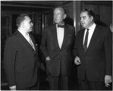 Harry Saltman, right, Ian Fleming and Cubby Broccoli pose for a photo after signing their agreement to produce the first James Bond film in 1962, taken from Bond on Bond by Roger Moore. Copyright: 1962-2012 Danjaq LLC and United Artists Corporation
