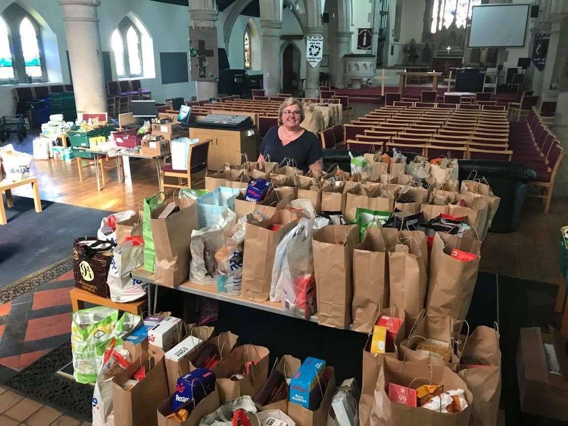 Debbie Ellisdon, pictured with food parcels at St. Paul's Church