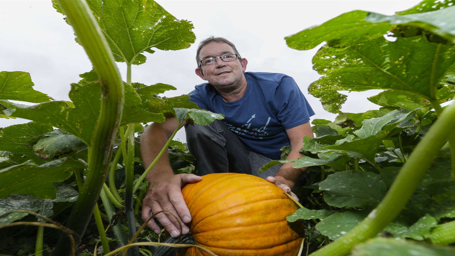 Farmer Charlie Eckley with one of his pumpkins at his new venture Pumpkin Moon in Boxley