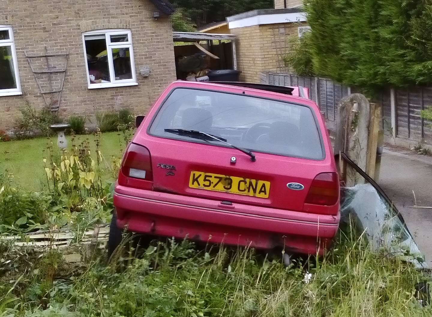 The car came to rest in a garden