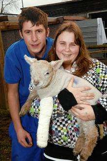 Nick Cooper, 16, and Emma Stuart, 15, with Lucky the Lamb at Meopham School