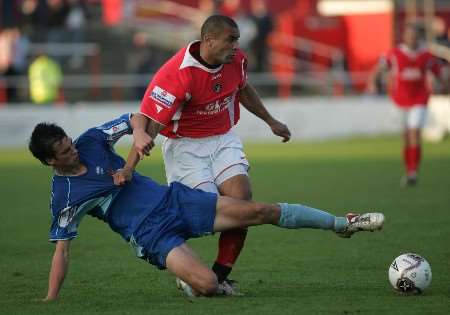 Gravesend's Kim Grant is tackled by Stevenage's Ollie Berquez. Picture: RICHARD EATON
