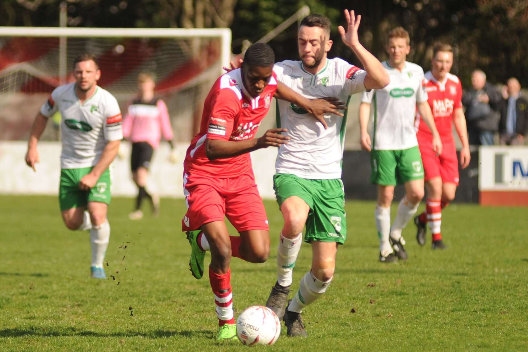 Ade Batula (red) battles but Chatham's 4-1 defeat to Guernsey last week leaves Paul Piggott's side 12 points from safety Picture: Steve Crispe