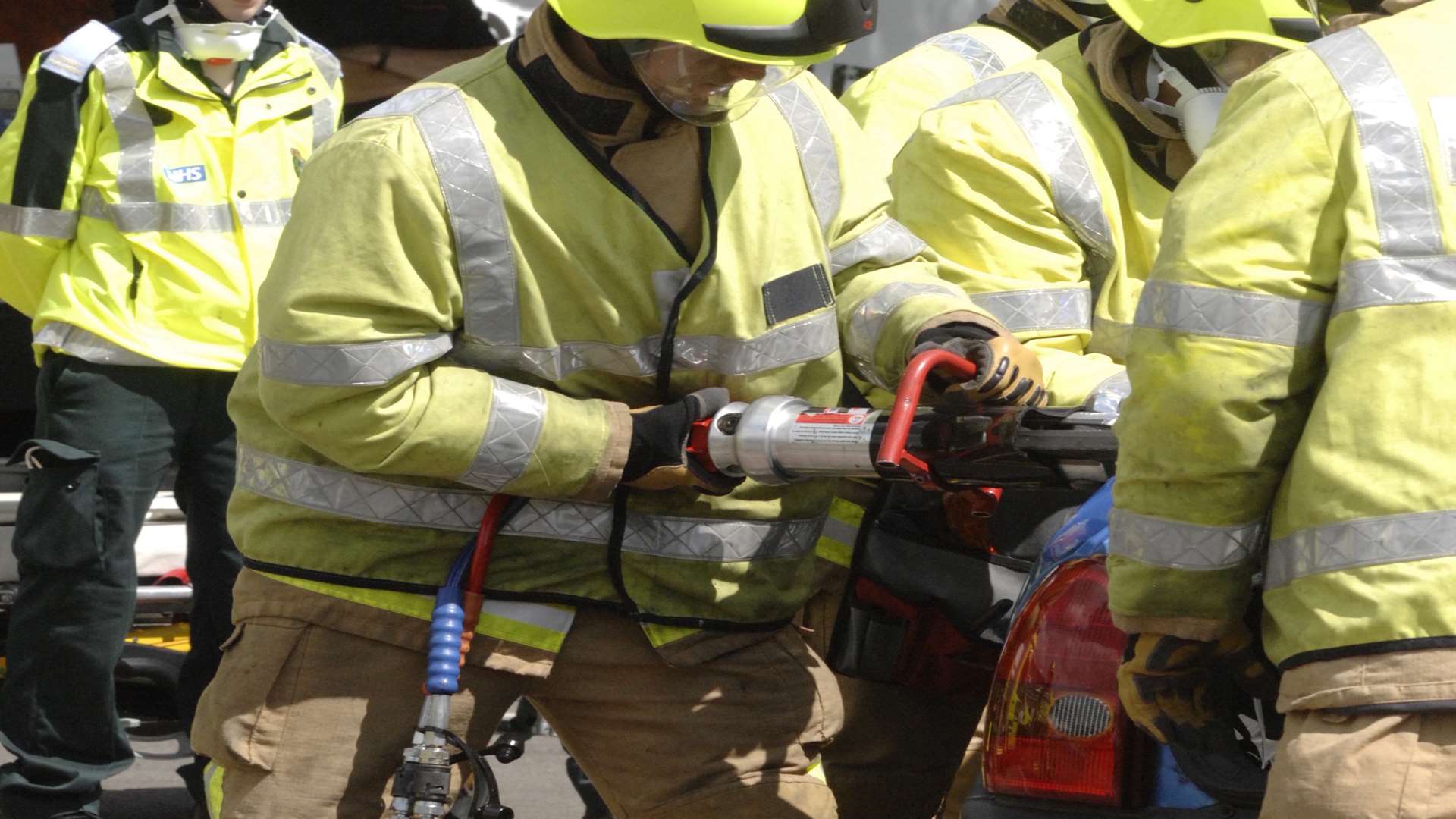Firefighters using cutting gear. Stock image