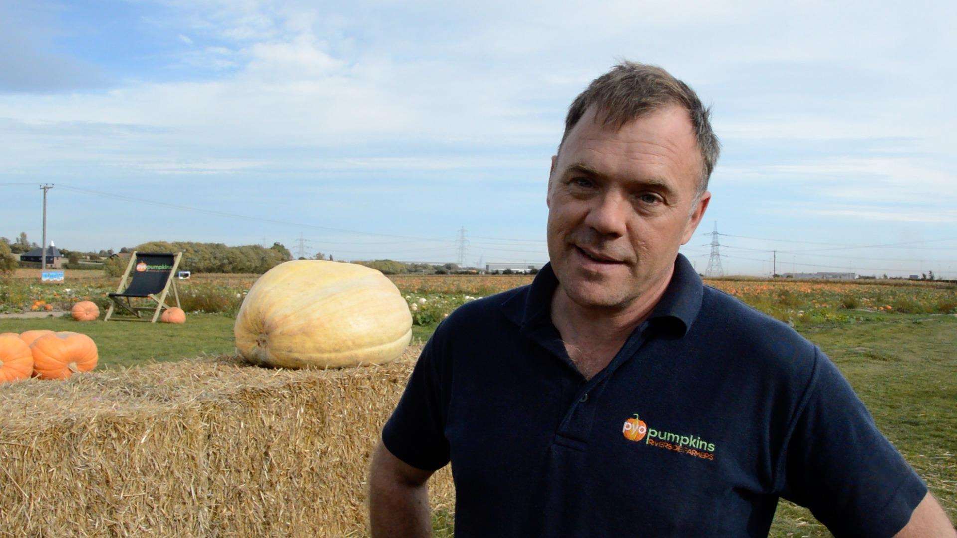 Farmer Mark Batchelor with his massive pumpkin (4856100)