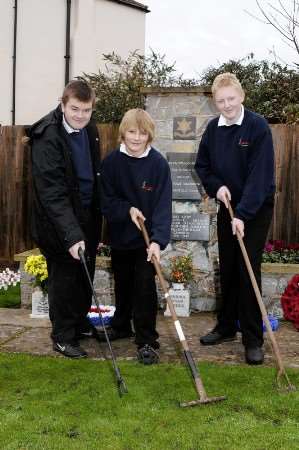 George Flannagan,Ian Johnson and Anthony Laslett of Ripplevale School ready to clean up around the memorial