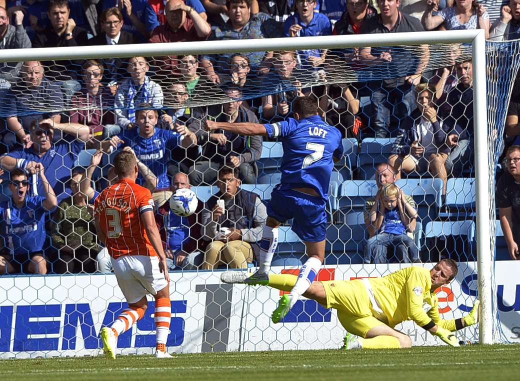 Doug Loft opens the scoring for Gillingham Picture: Barry Goodwin