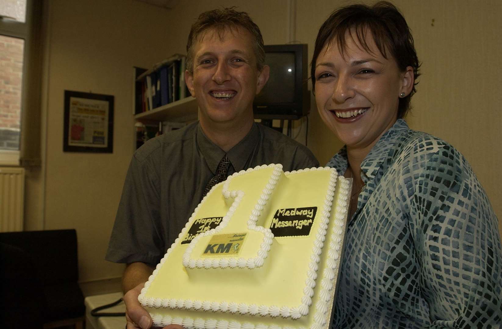Celebrating Medway Messenger's first birthday, Bob Dimond and Nikki White with a cake