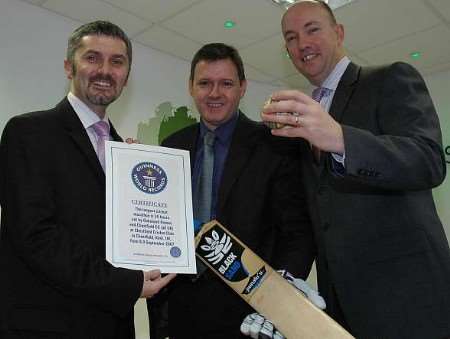 Managing director of Oakwood Homes Andrew Dickinson celebrates the new record with associate directors Steve Evans and Paul Jordan