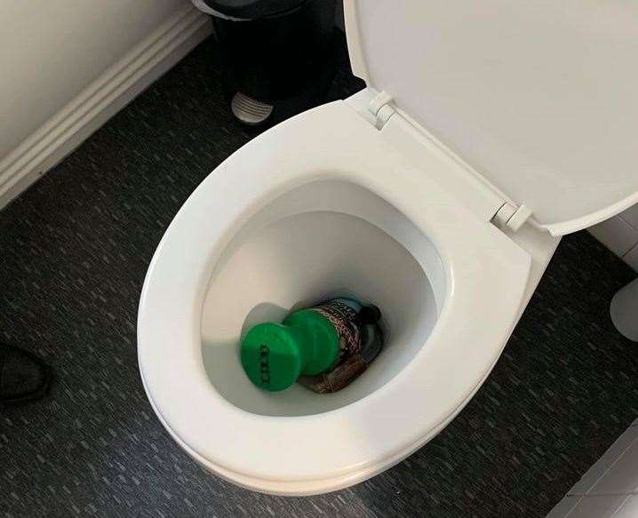 A charity collection container thrown down the toilet (28316288)