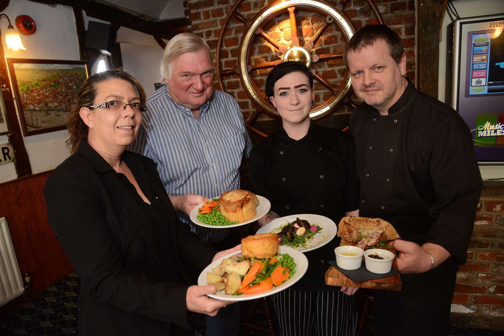 Note: photo taken before social distancing rules. Lester Banks, second from left, and his chefs are serving up award winning meals at discount prices. Picture: Gary Browne