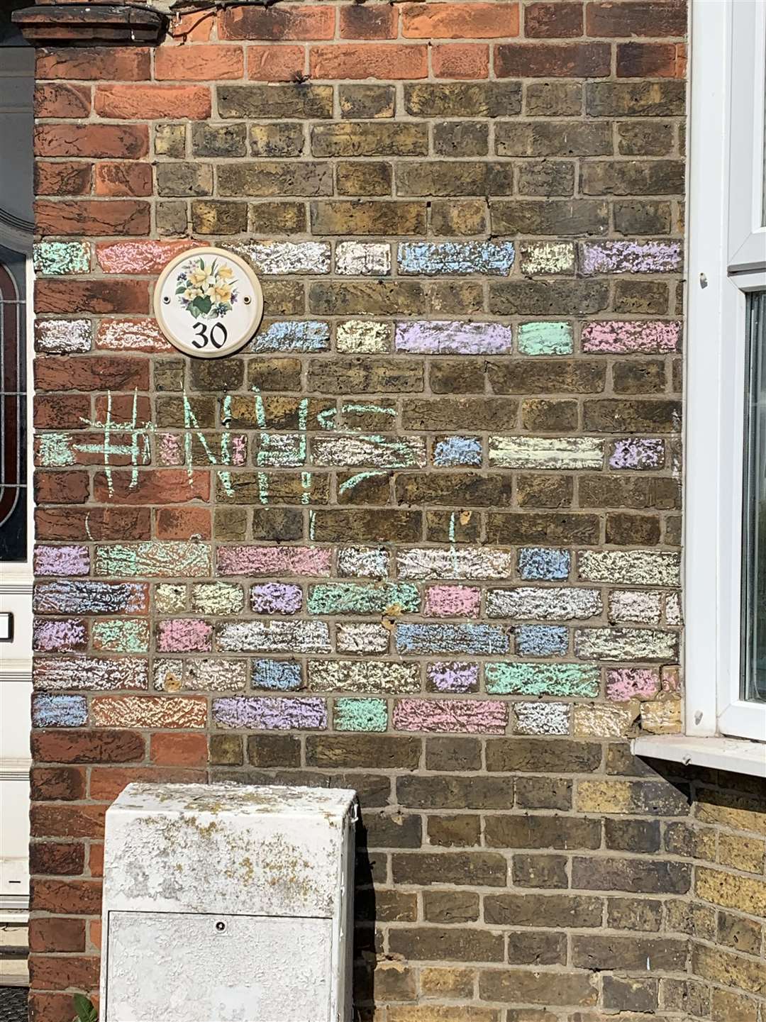 A colourful chalk design has been etched on a home in Court Road