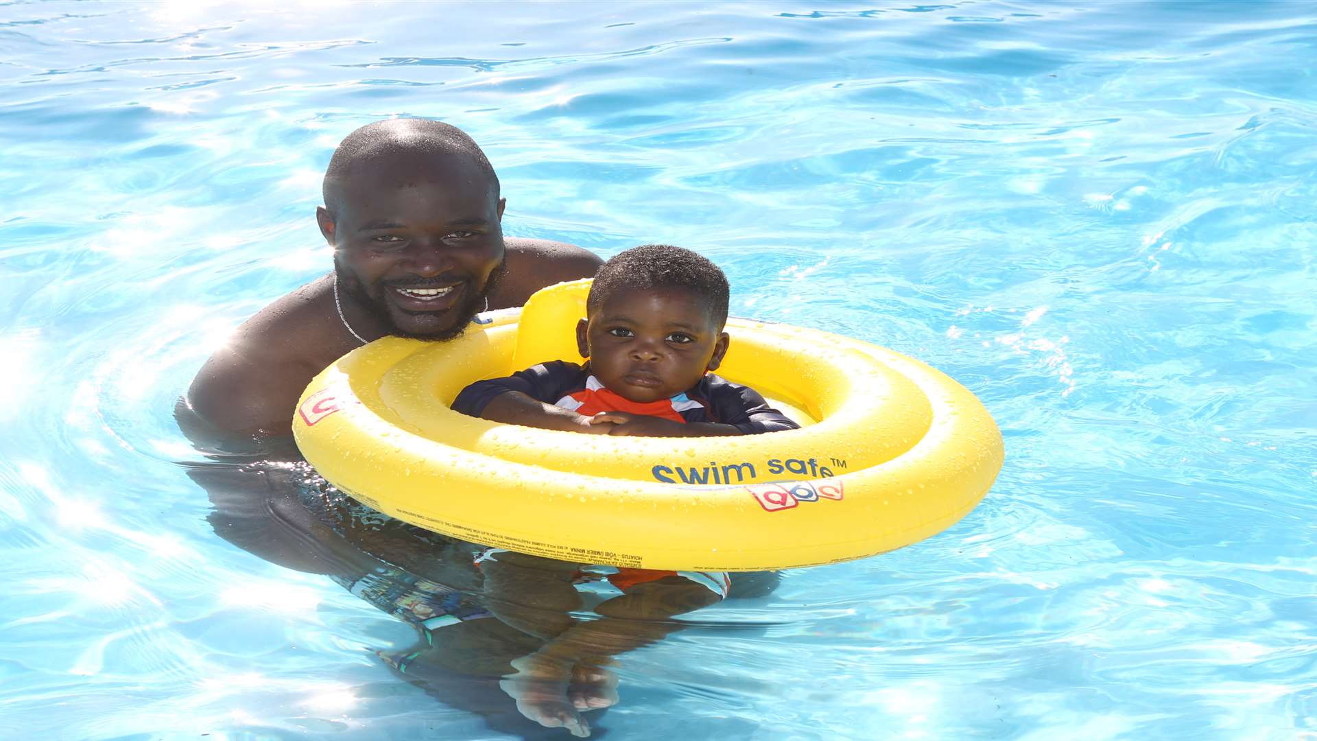 Mino Acho with his son Banue, 14 months