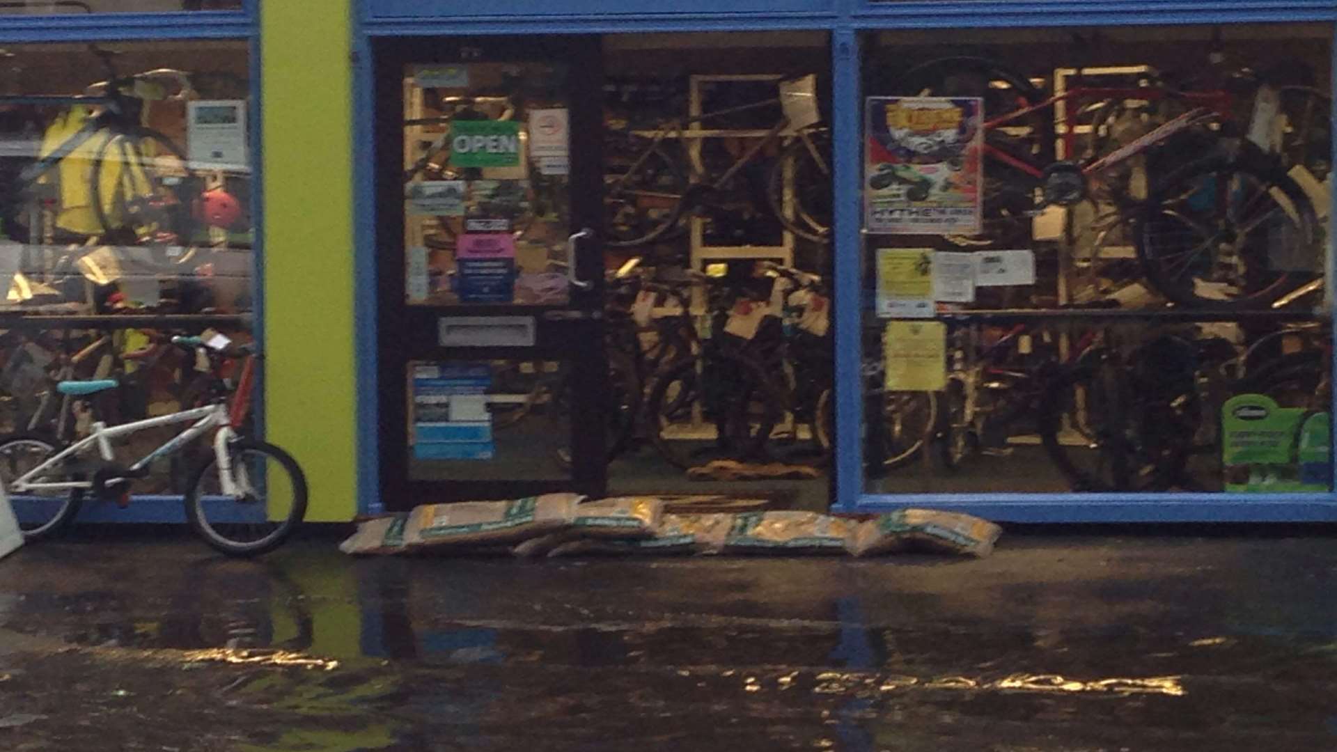 A sandbagged shop at New Romney High Street during flash flooding.