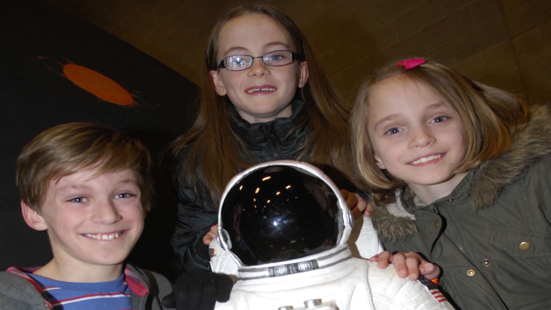 William Sargent, Emily Mackay and Katie Sargent meet a little spaceman. Picture: Martin Apps