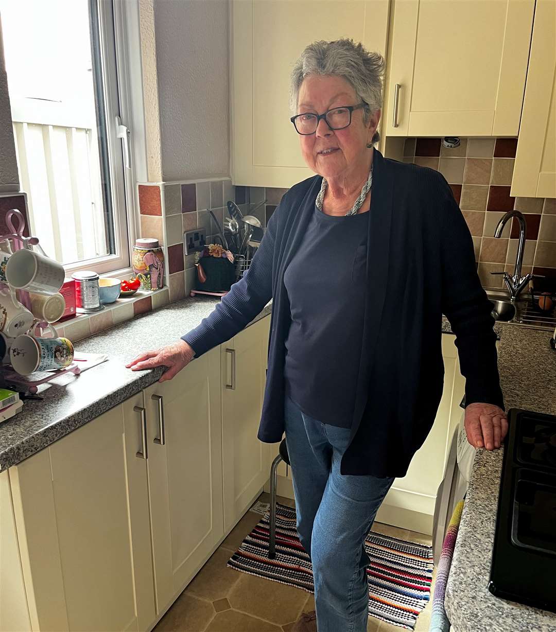 Christine Evans does not want to lose a kitchen cupboard for her water meter to be installed