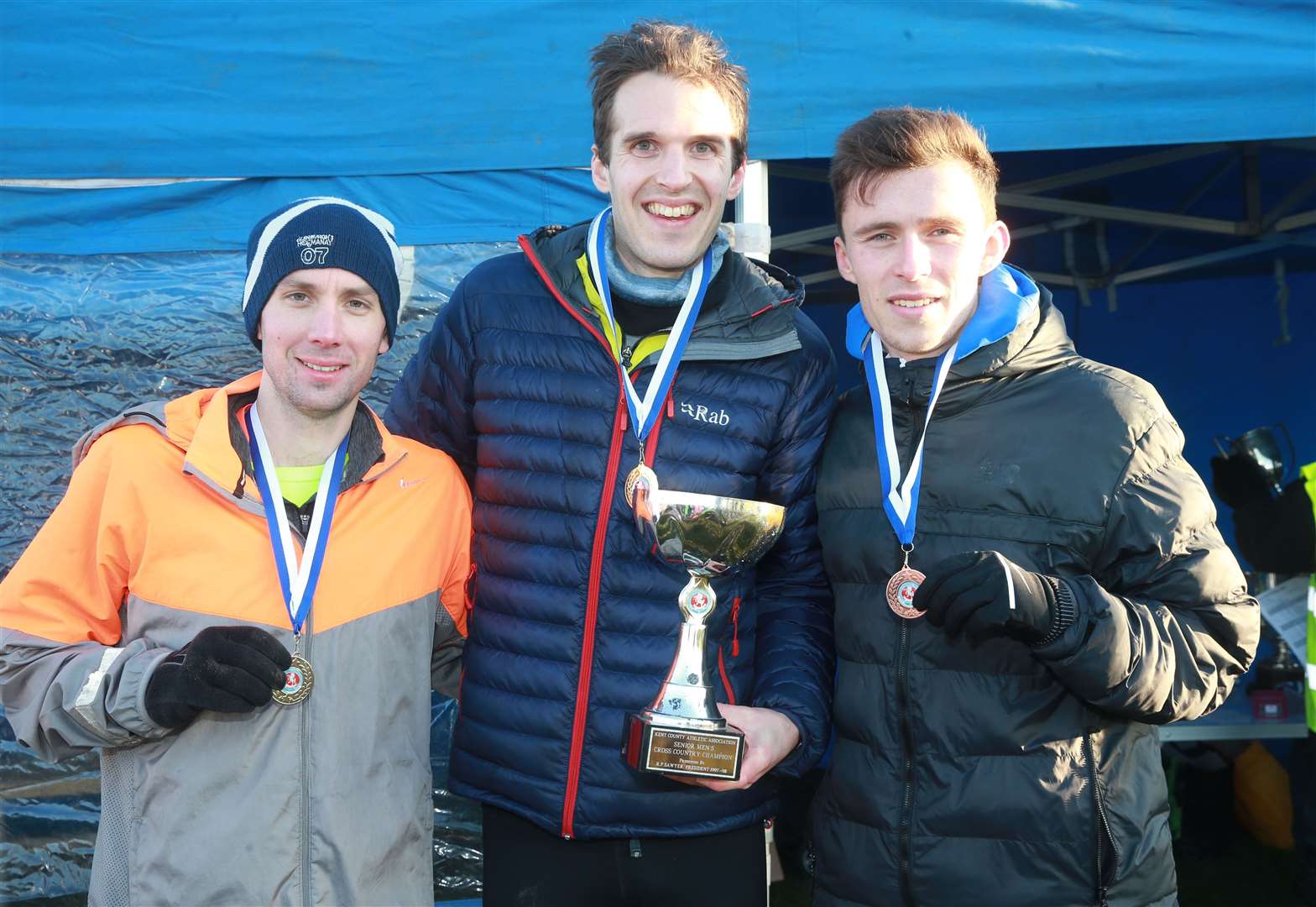 From left, Ben Cole, from Tonbridge AC, came in second, Owen Hind, from Kent AC, the winner and Corey De' Ath, from Tonbridge AC, came in third in the senior men's race at the Kent Cross-Country Championships Picture: John Westhrop FM25930169