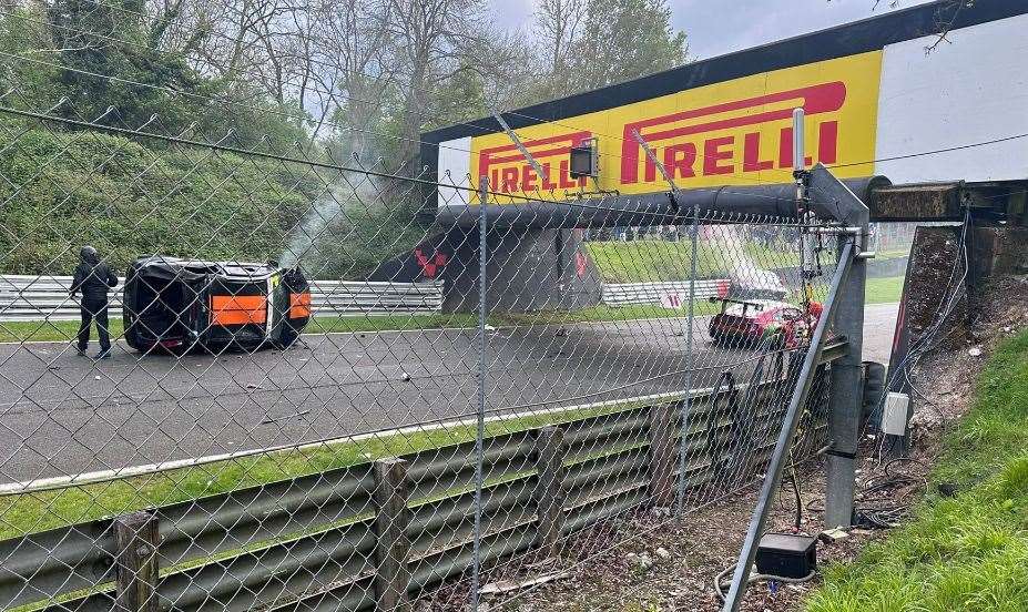 Andrew Stenning's Ford Fiesta rolled into the middle of the circuit and was hit by Keith White’s red BMW; Birley’s BMW is on the grass on the other side of the vehicle bridge. Picture: Joseph Petrassi