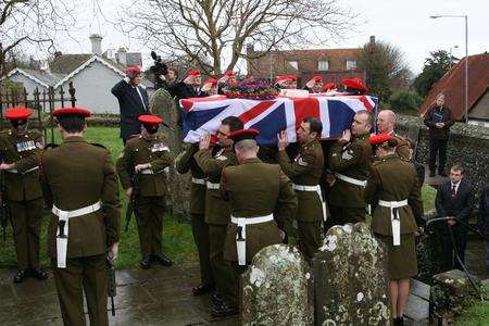 Sgt Robert Loughran-Dickson's coffin is carried into the church. Picture: Terry Scott