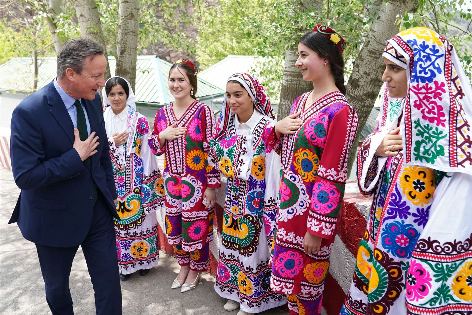 Lord Cameron meets local women at the Nurek Hydro-Electric Project, as he visits Tajikistan during his tour of the Central Asia region (Stefan Rousseau/PA)