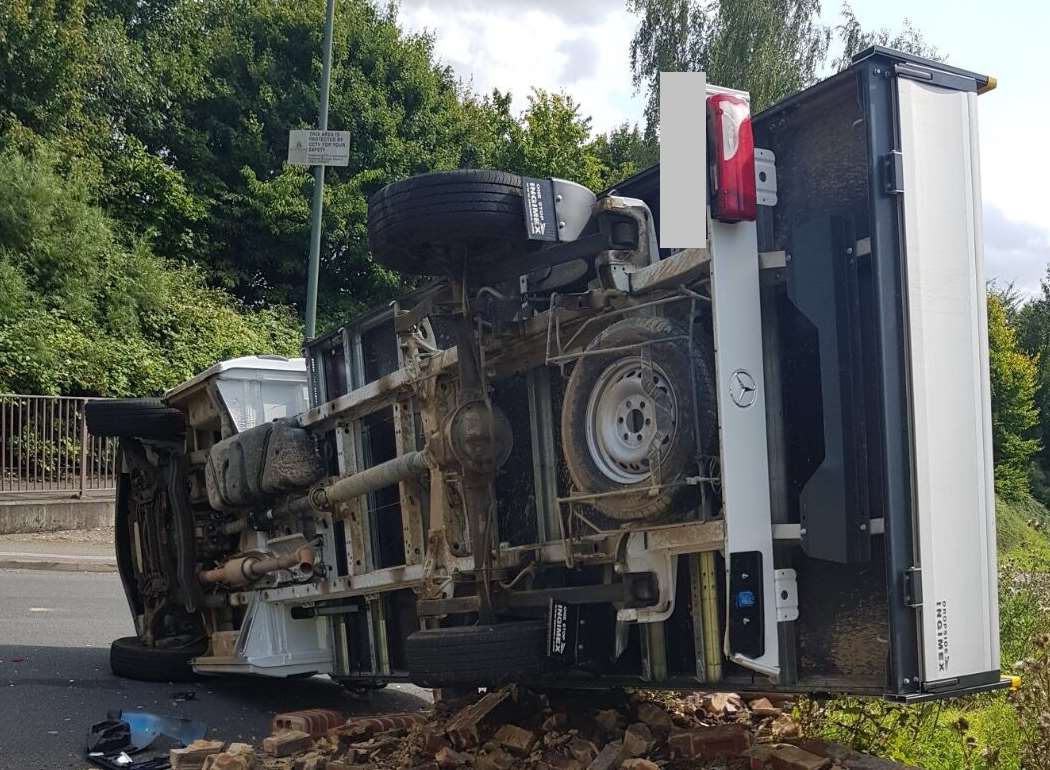 Another view of the truck which has overturned on the Ringlestone Roundabout, causing long delays. Picture: Adedeji Adebanwo