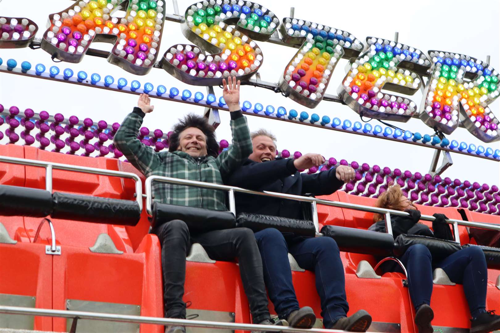Ups and downs of council life: Swale council leader Cllr Mike Baldock, left, with Carlos Christian on the Master Blaster ride at Smith's funfair, Barton's Point, Sheerness