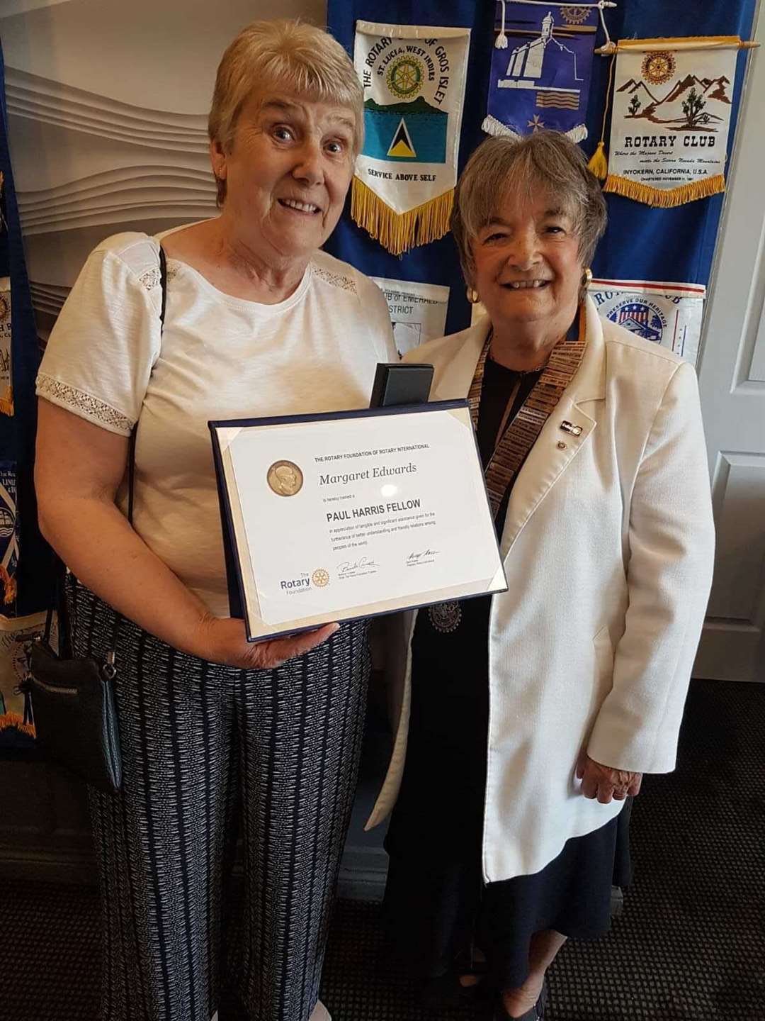 Rotary's Marlene Burnham presents Margaret Edwards with her Paul Harris Fellowship Award