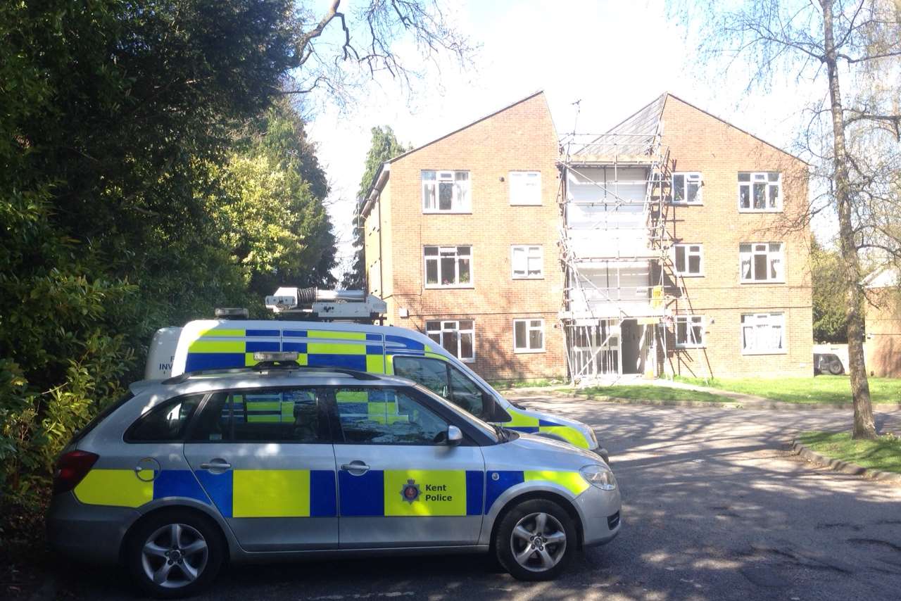 A heavy police presence was seen outside the Rusthall Grange flats following the death. Picture by Matthew Walker.