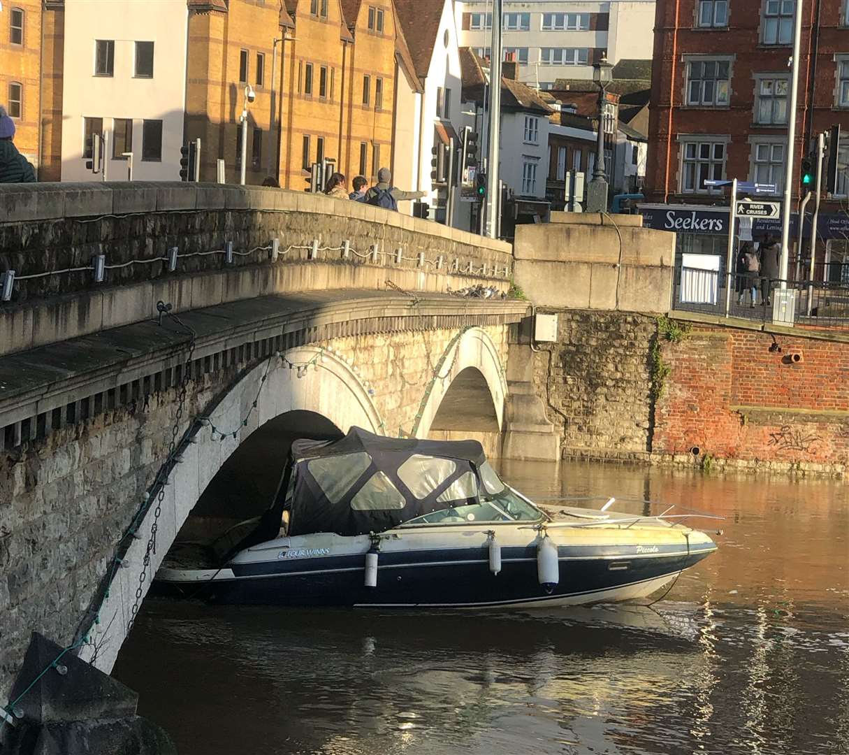 A boat became stuck under a bridge over the River Medway in the centre of Maidstone. Picture: Bobby Kerr