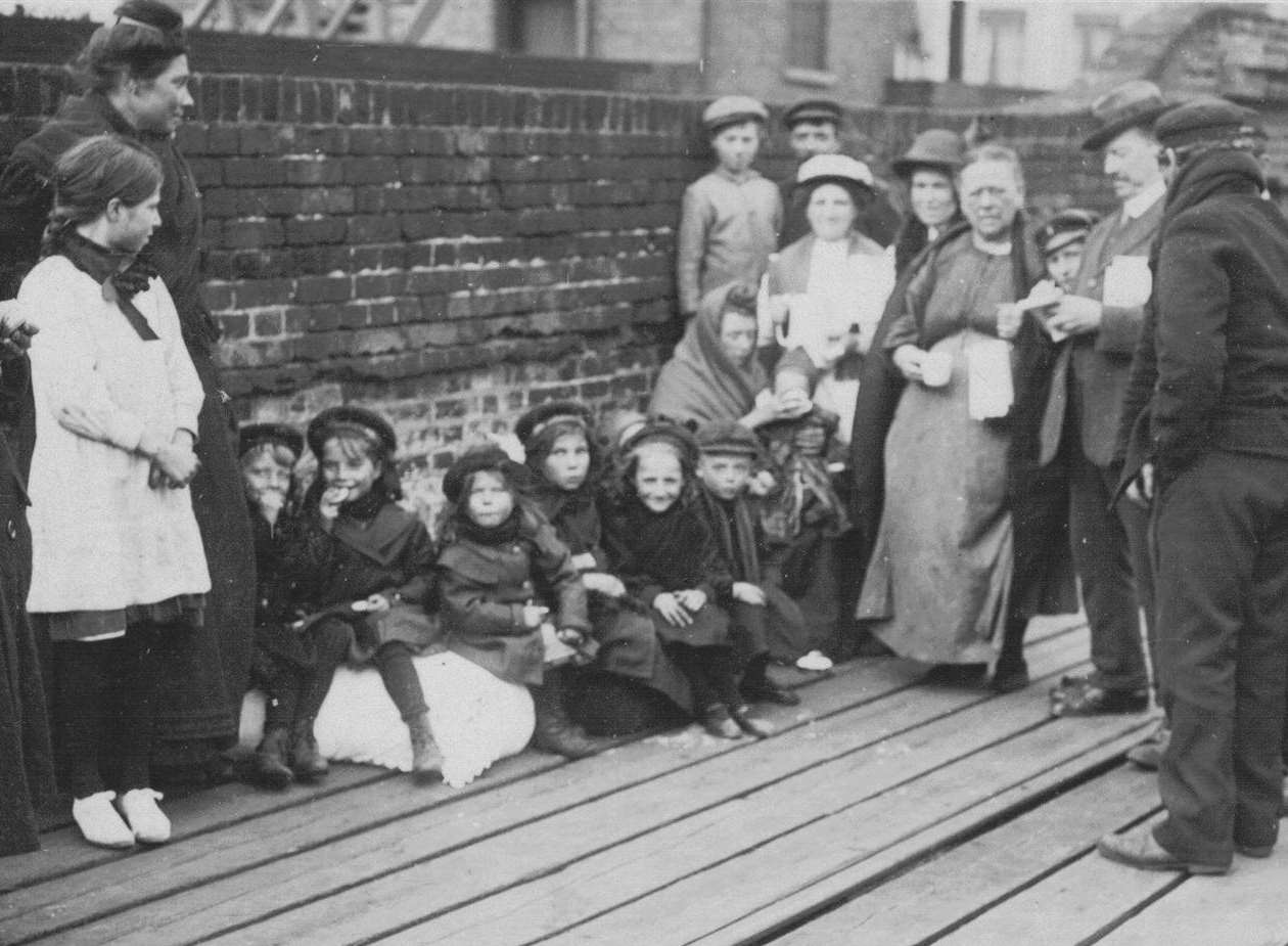 The Belgian families families seen here are on the wooden jetty at the side of the railway branch line to the harbour. Picture courtesy of Alan Taylor