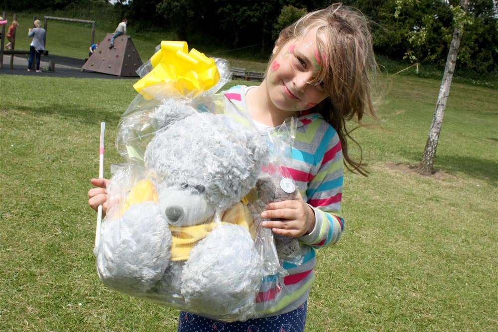 Chloe Bloor, eight, from Milton, with the prize she won on the raffle at Regis Manor Primary School