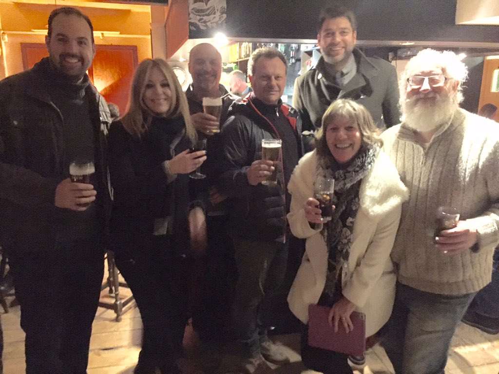 Campaigners celebrate with a pint after the meeting