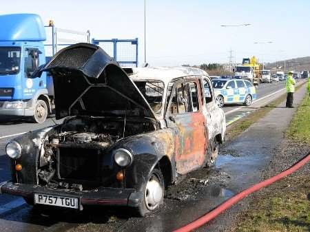 The burnt out black cab on the Thanet Way