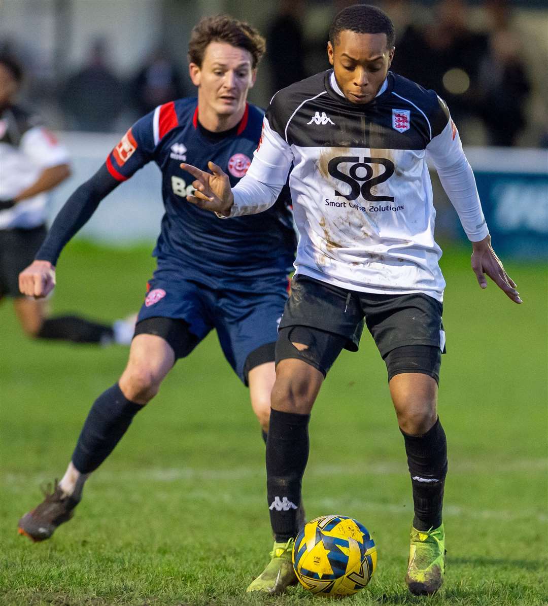 Faversham's Kieron Campbell is closed down by Chatham’s Billy Bennett. Picture: Ian Scammell