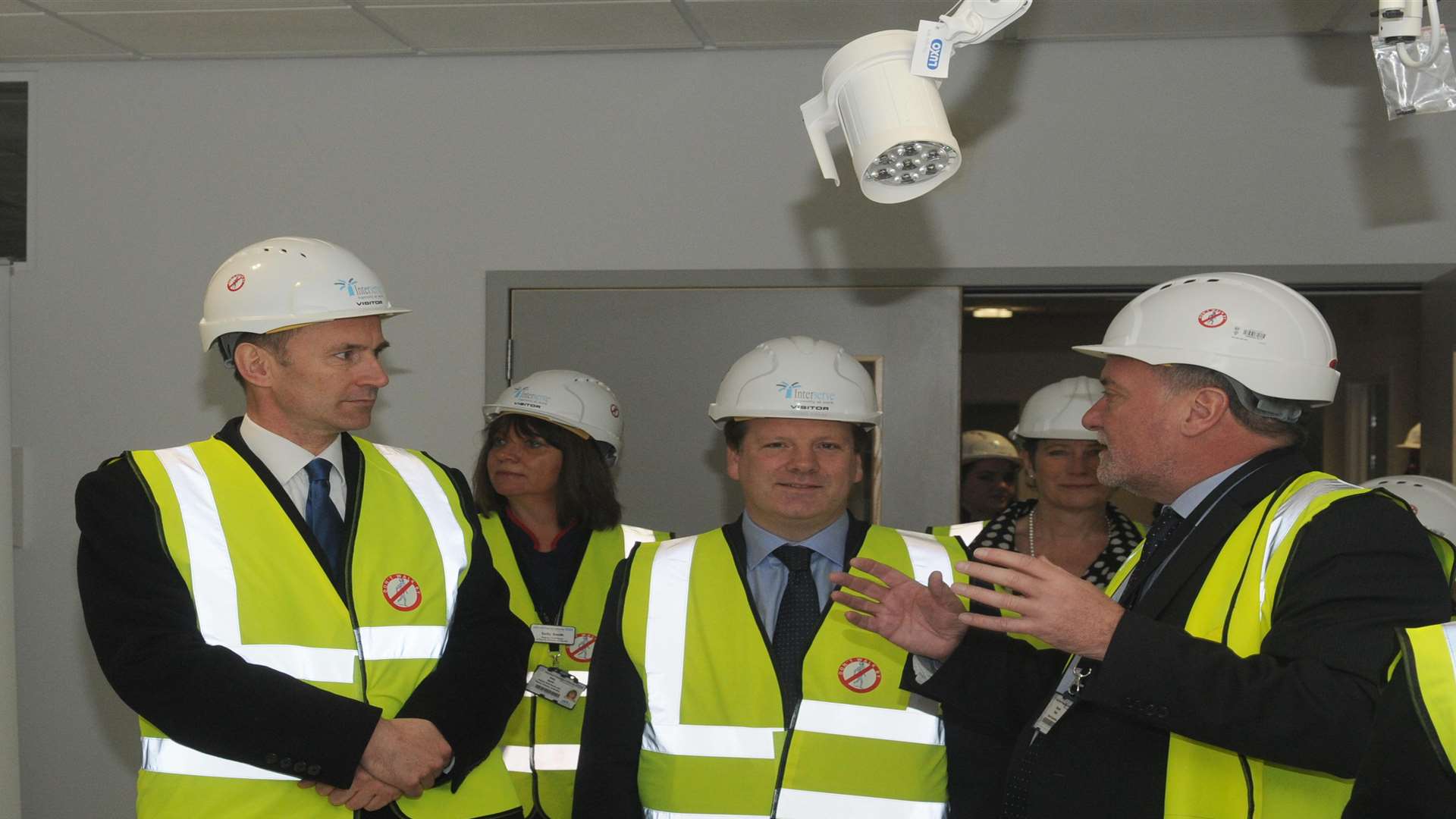 Health Secretary Jeremy Hunt (middle left) and MP Charlie Elphicke (middle right) during the tour