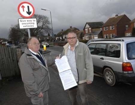 Tony Monk and Cllr Brian Mortimer (Lib Dem) beside the traffic calming measures. Picture: Matthew Reading