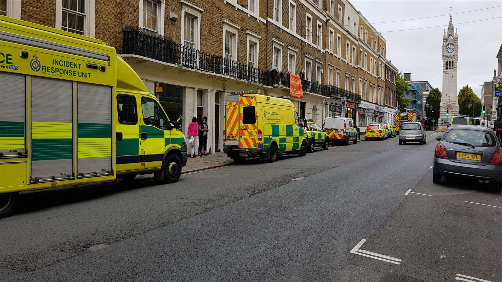 Six ambulance service vehicles were seen in Harmer Street