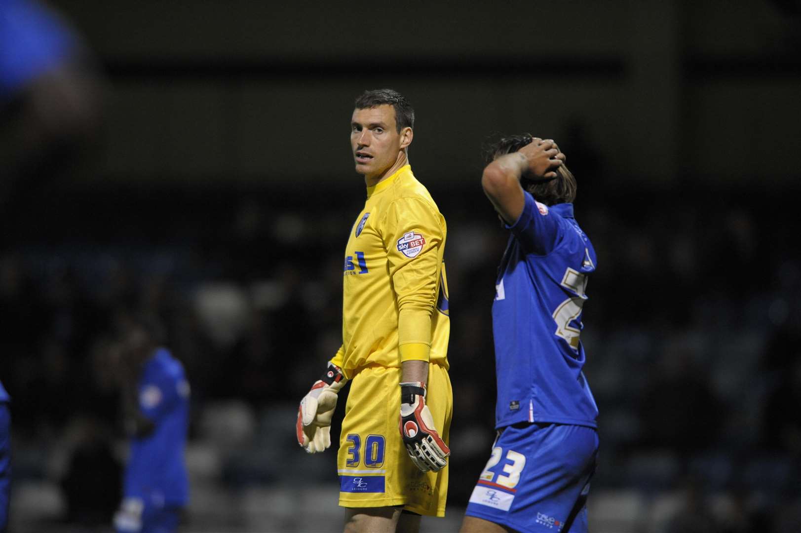 Keeper Stephen Bywater looks back at Gills' defenders after scoring an own-goal against Swindon Picture: Barry Goodwin