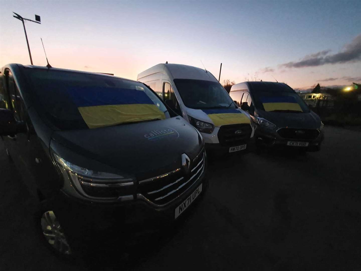 The vans sporting the Ukrainian flag. Picture: Vilius Domarkas