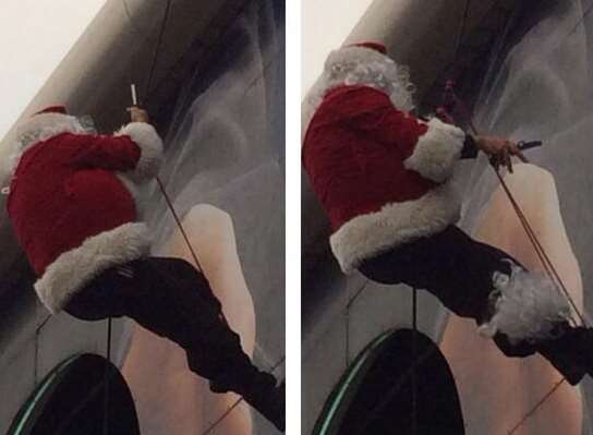 This Santa didn't get stuck up a chimney but in some abseiling ropes. Picture: Lea Swain