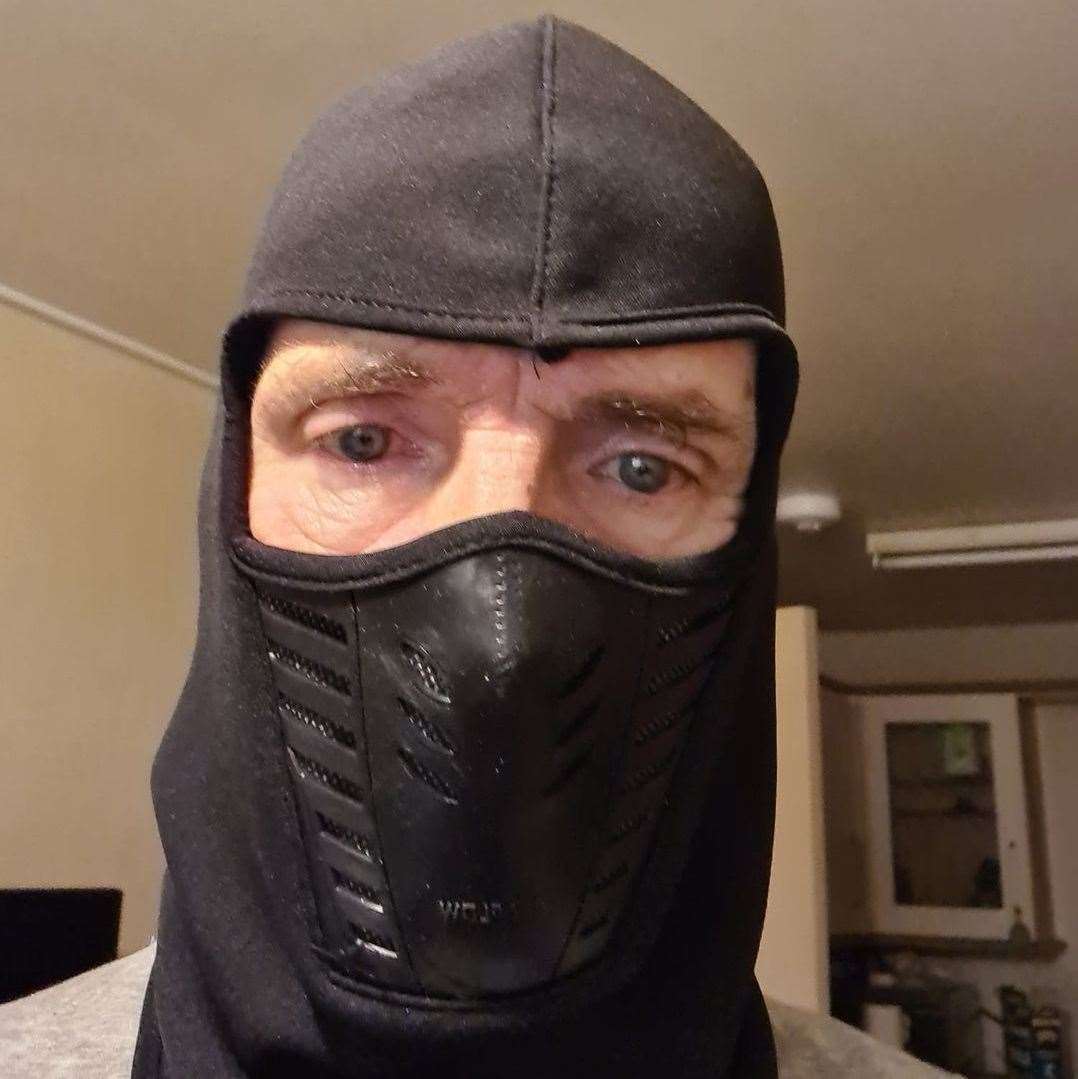 Leak posed in a balaclava and mask
