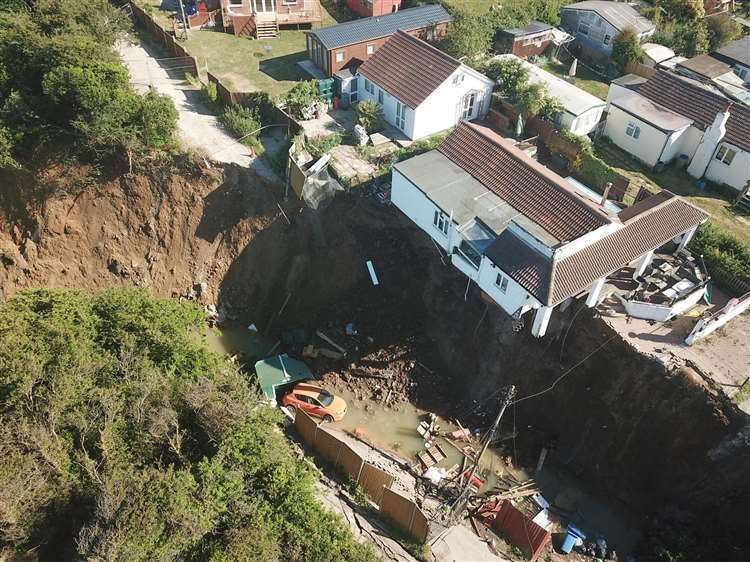 Emma Tullett's home about to plunge down the cliff at Eastchurch. Drone picture: Henry Cooper