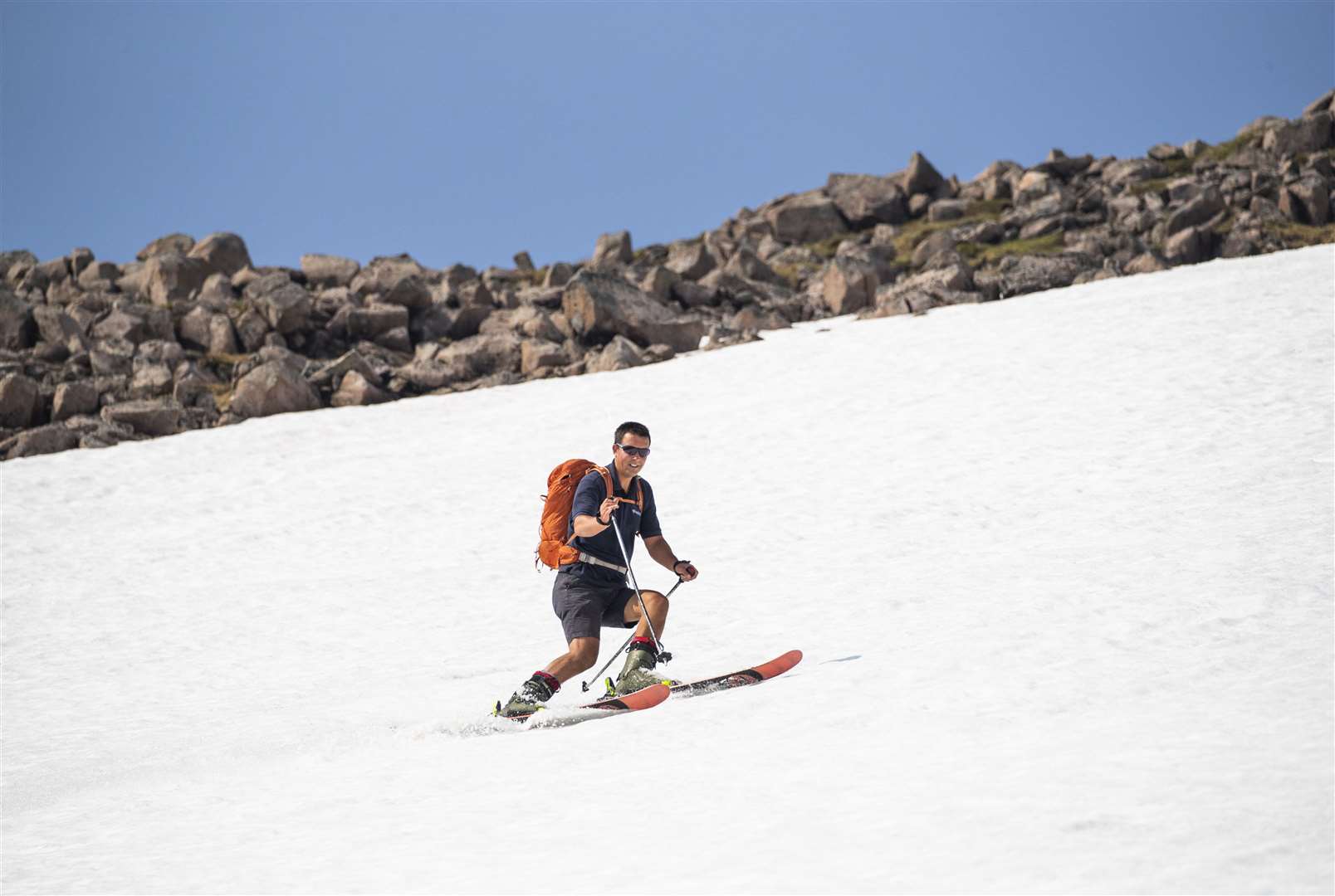 Andy Meldrum, owner of the Glencoe Mountain Resort, skied on some of the remaining snow and was able to do so in shorts thanks to the bright sunshine (Jane Barlow/PA)