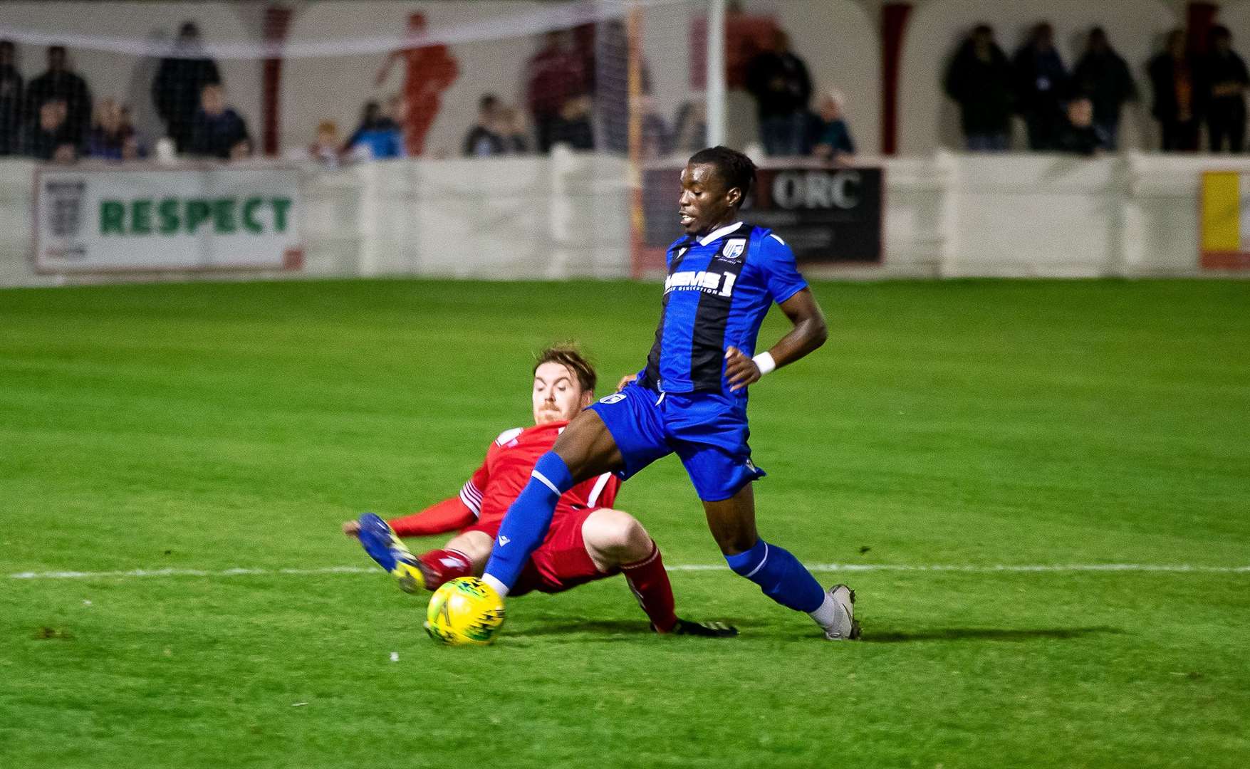 Jake Mackenzie slides in on Gerald Sithole as Whitstable take on Gillingham Picture: Les Biggs